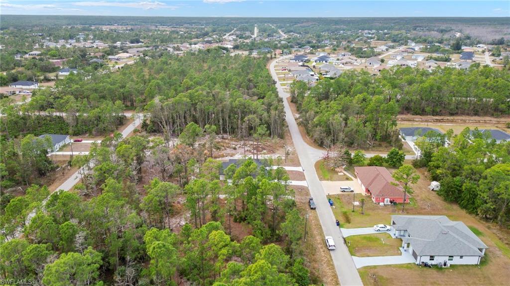 View of property location with nearby suburban area