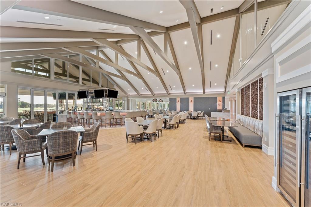 Building lobby featuring high vaulted ceiling and recessed lighting