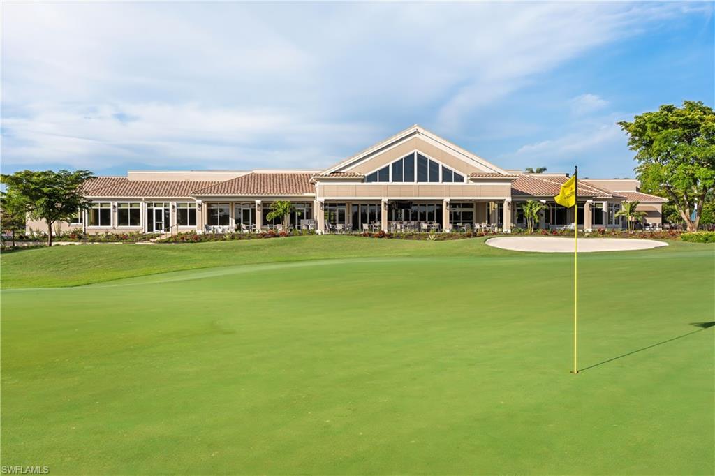 Surrounding community featuring a putting area and a yard
