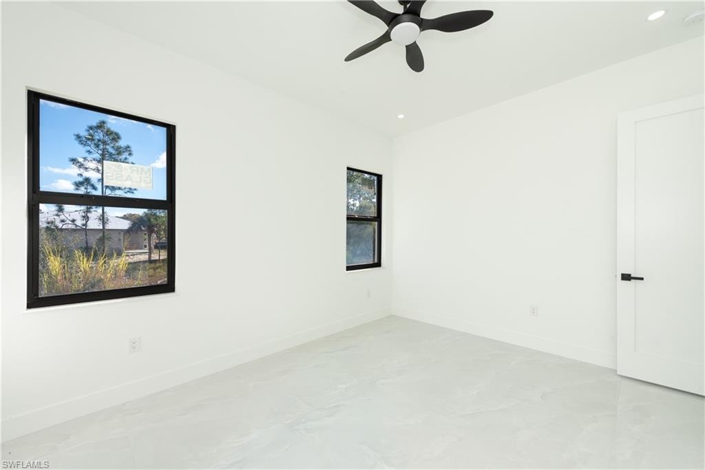 Unfurnished room featuring ceiling fan and recessed lighting