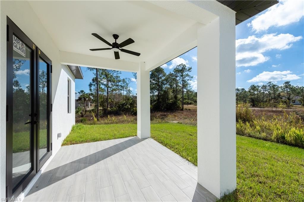 View of patio with a ceiling fan