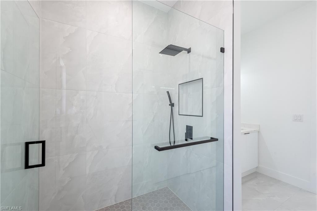 Bathroom with a stall shower and vanity
