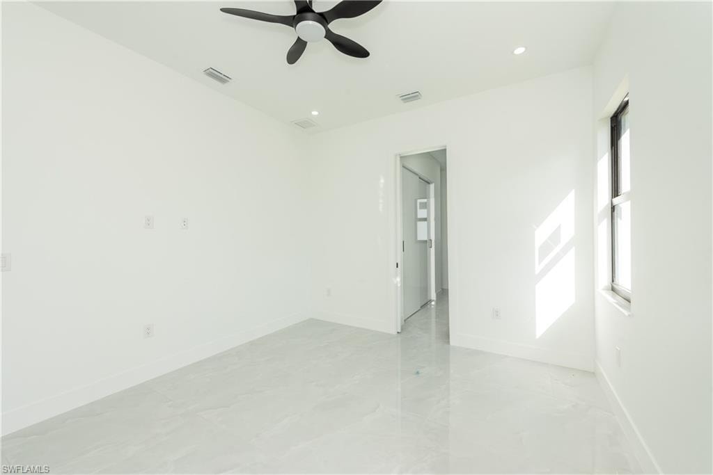 Spare room featuring a ceiling fan and recessed lighting