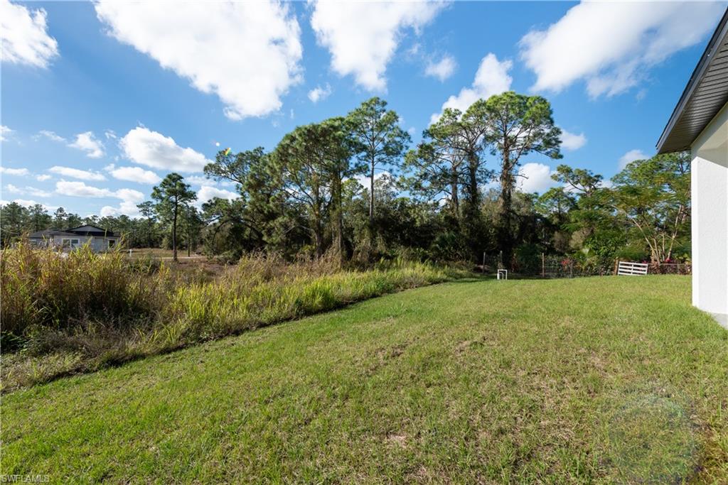 View of yard featuring view of wooded area