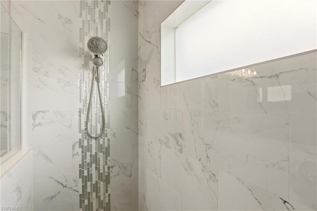 Bathroom view of a marble finish shower