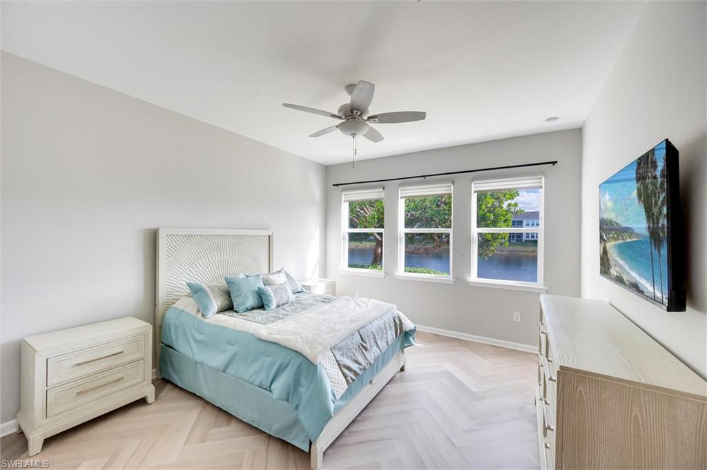 Primary Bedroom with a water view
