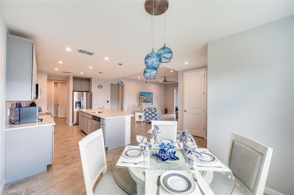 Dining room featuring light wood-style floors and recessed lighting