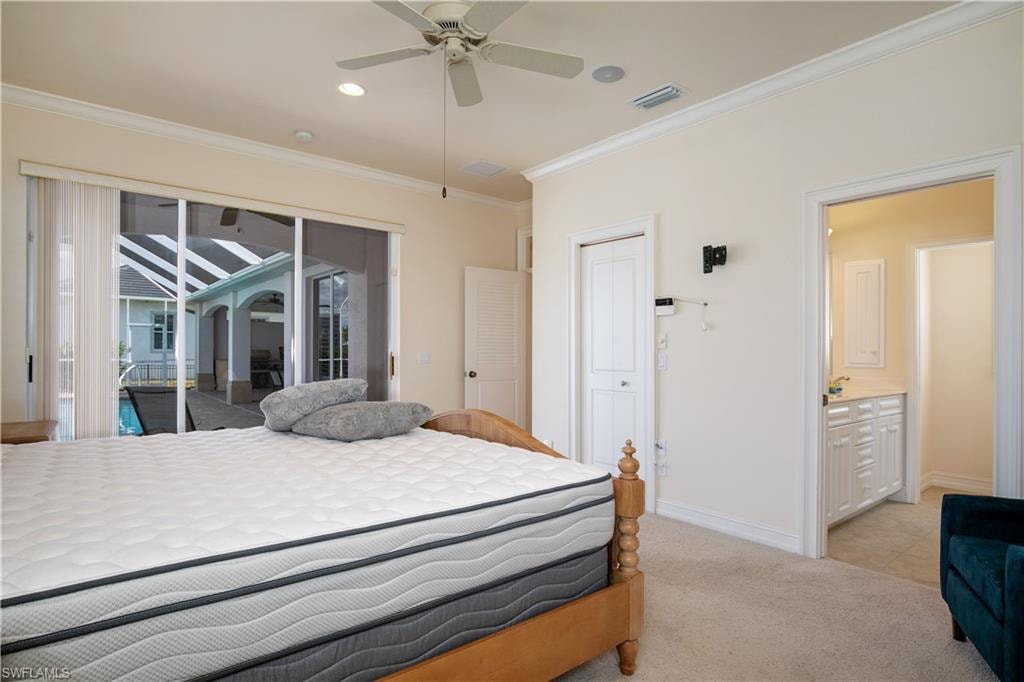 View of Primary-2 Suite with Walk In Closet, Bath Entry and Slider to Primary-2 Deck Seating and Pool Deck.