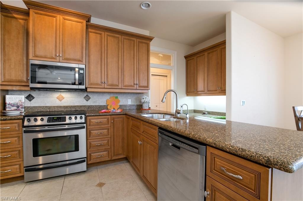 View of Kitchen with Granite Counters, Under Cabinet Lighting and Stainless Package