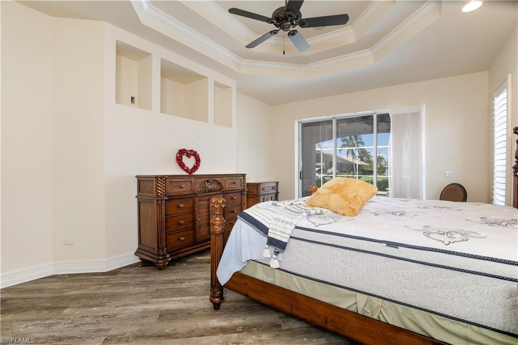 View of Coffered Primary-1 Suite with Coffered Ceiling, Planter Shelfs and Pocketed Slider to Huge Lanai Under Truss