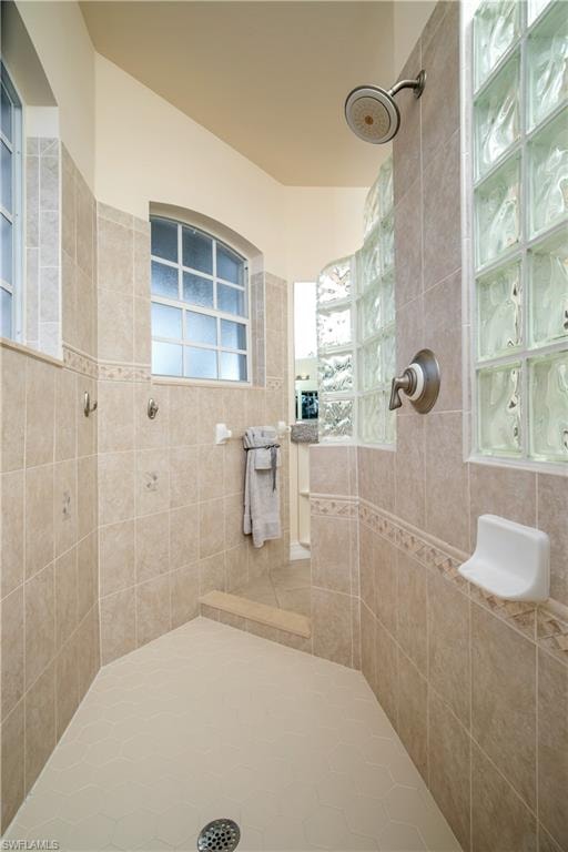 View of Sun-lit Primary-1 Walk Around Shower with Hollywood Block
