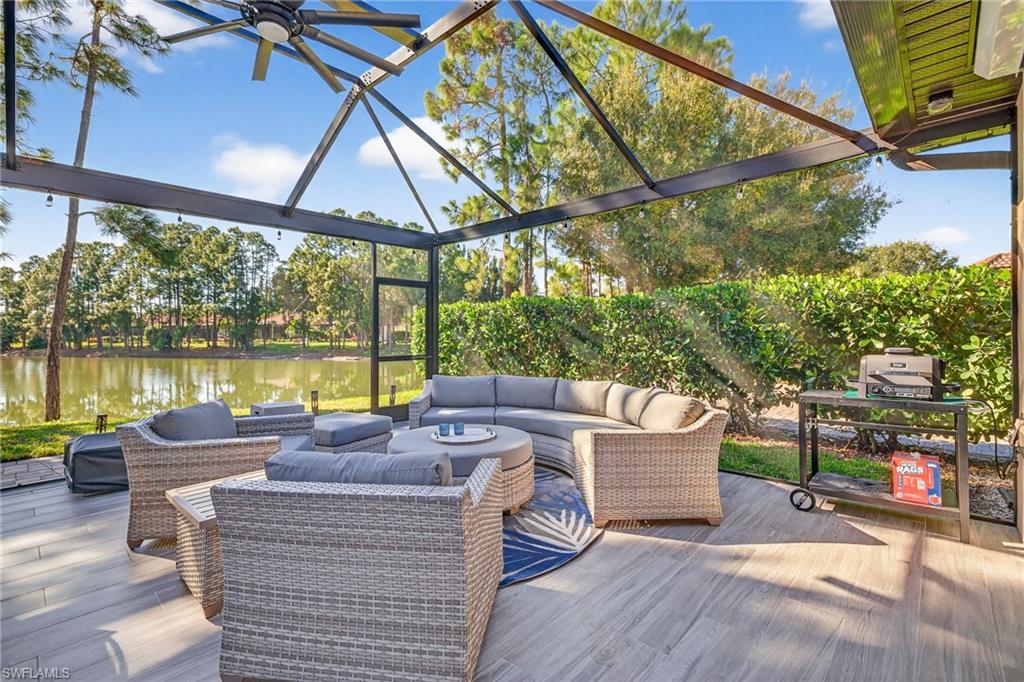 Wooden terrace with outdoor lounge area and a water view