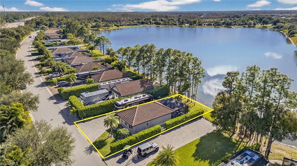 Aerial view of property's location with property boundaries highlighted and a large body of water