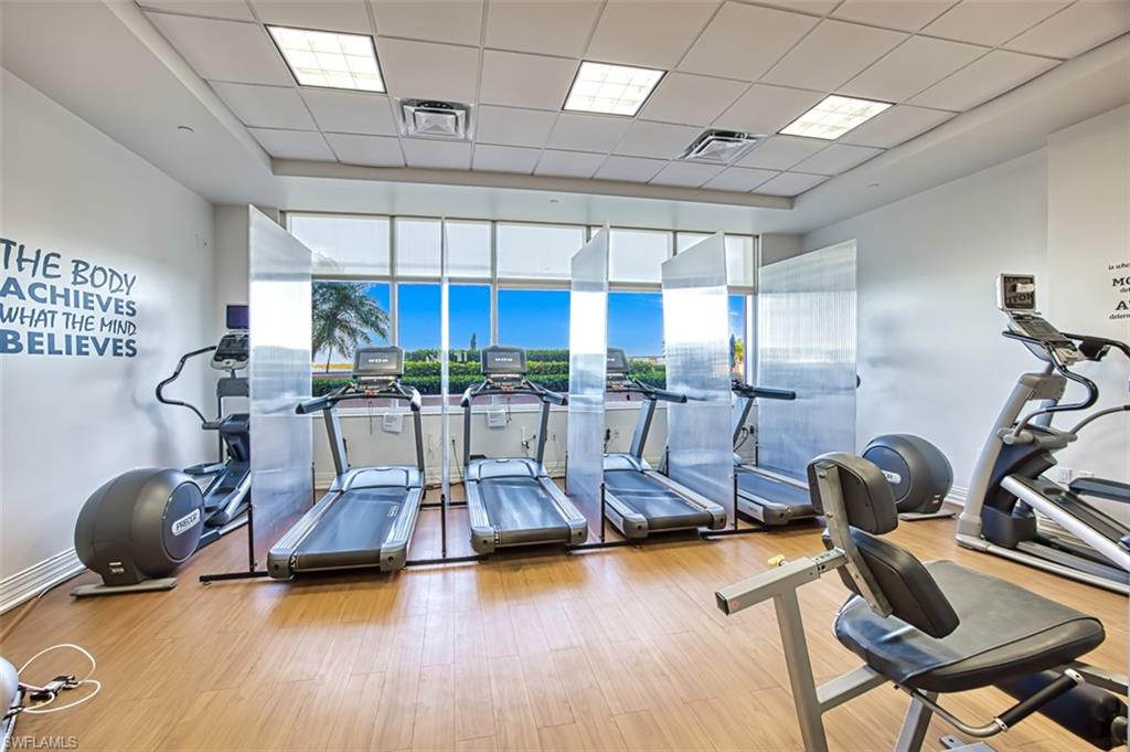 Workout area featuring a drop ceiling