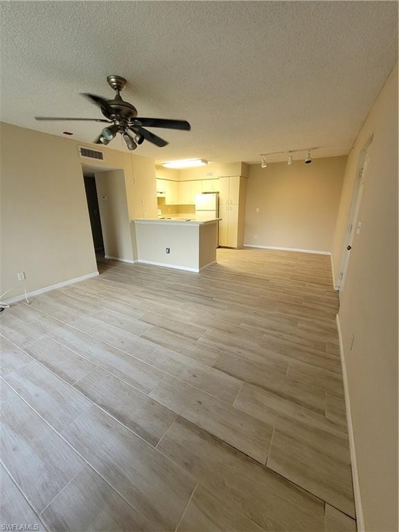 Livingroom, dining area.  Lovely light wood look tile flooring throughout the entire condo.  Light neutral colors.