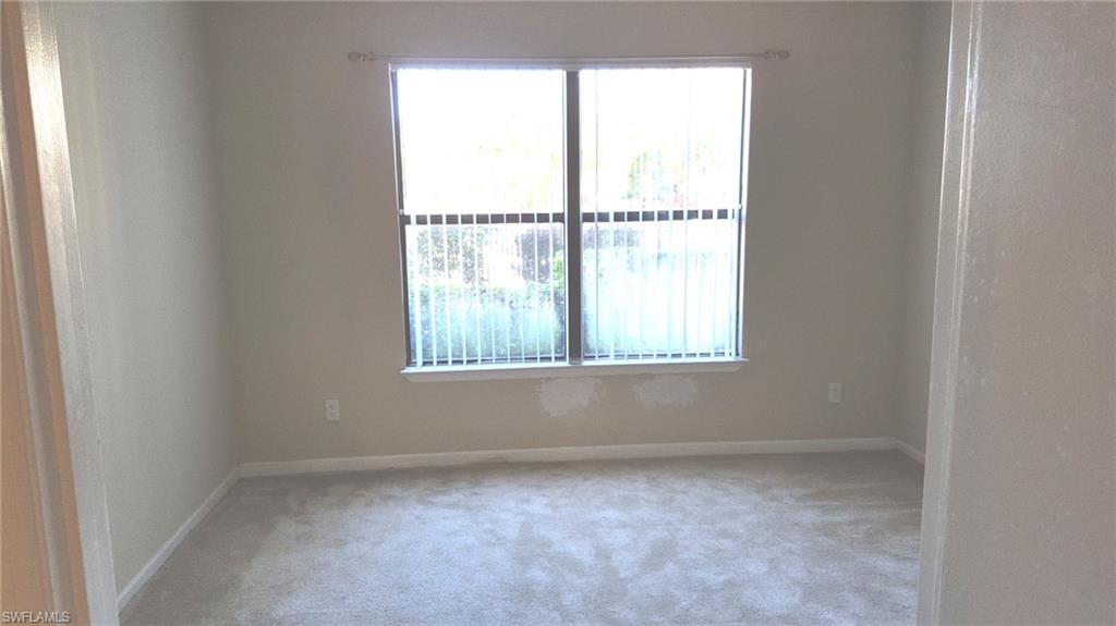This bedroom now has the light tile floors that look like wood.  Old picture with carpet.