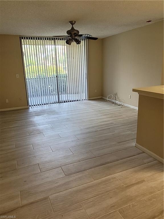 From Dining area looking out through livingroom to the screened lanai with the lovely tropical pool in the backgound.  Lovely space to relax.