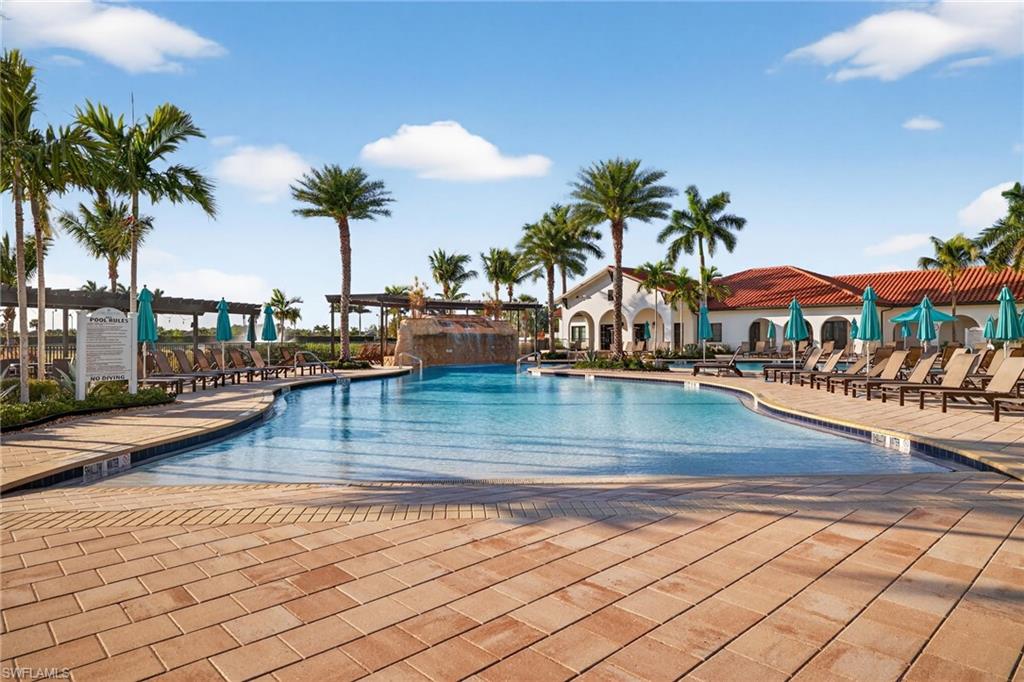 Community pool featuring a patio
