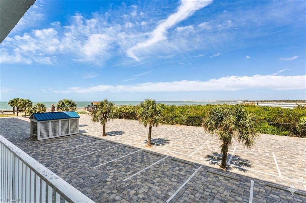 View from your back balcony, shared by the 2 bedrooms. This is a rendering with pavers-soon to be installed and railings to be painted.
