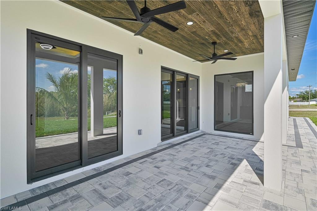 View of patio featuring ceiling fan