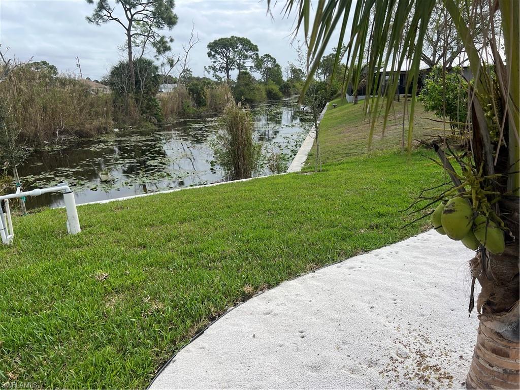 View of grassy yard featuring a water view