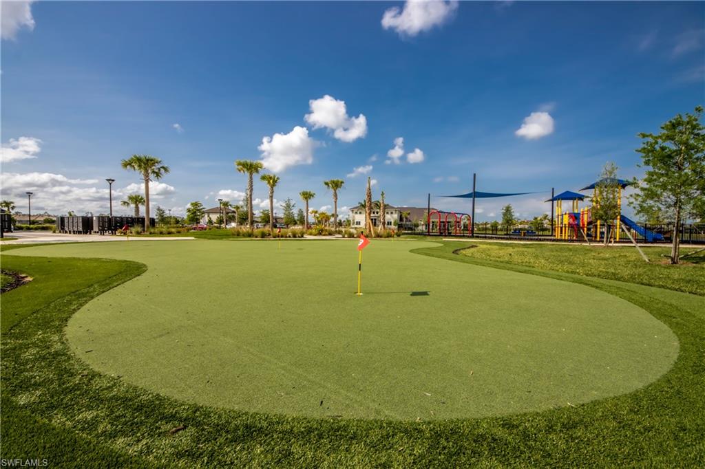 View of home's community with a putting green