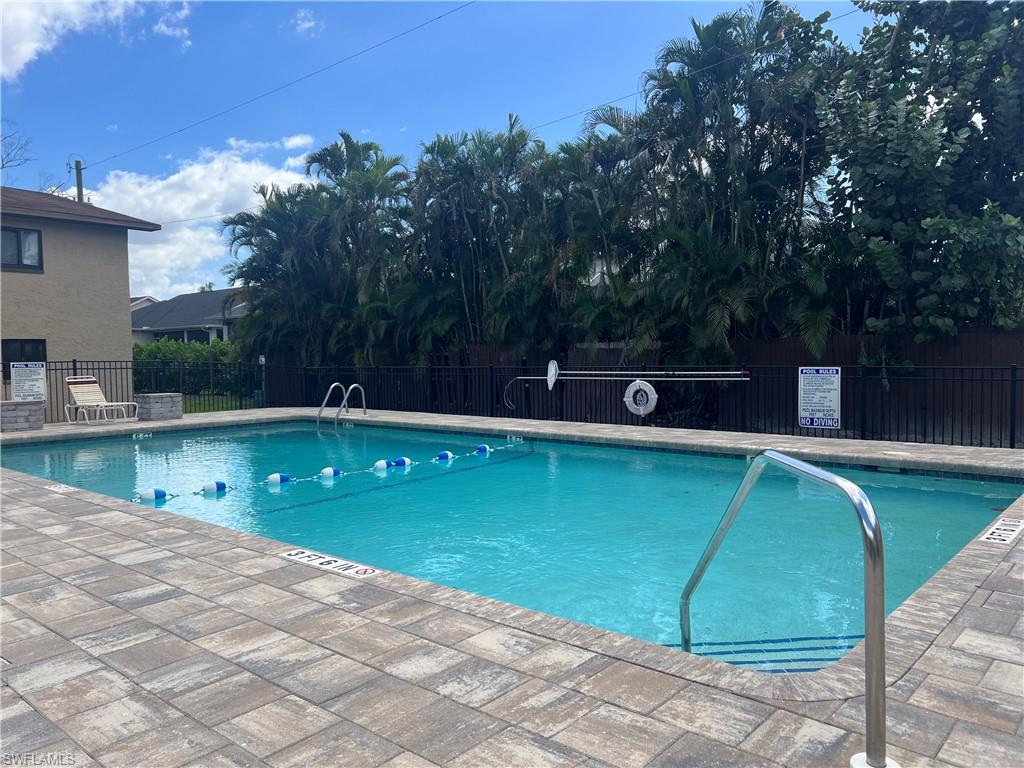 Community pool with a patio area