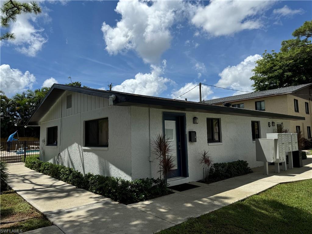 Single story home featuring stucco siding
