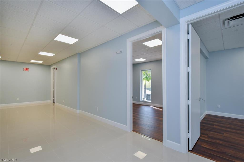 Unfurnished room featuring a paneled ceiling and tile patterned floors