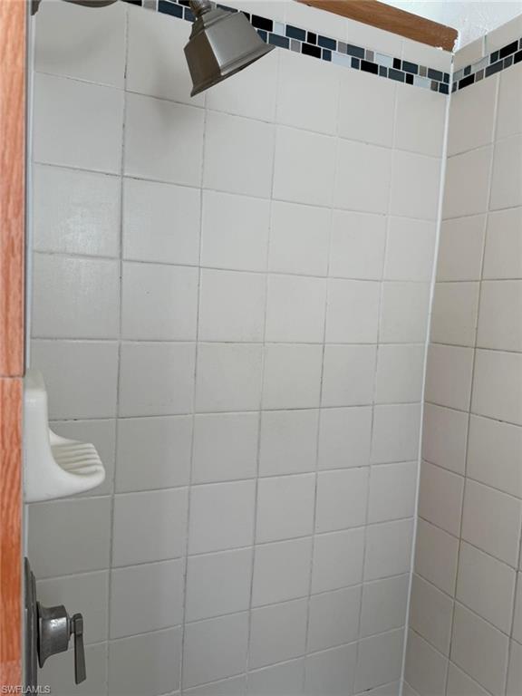Bathroom featuring a tile shower