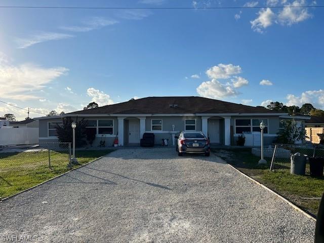 Single story home featuring driveway