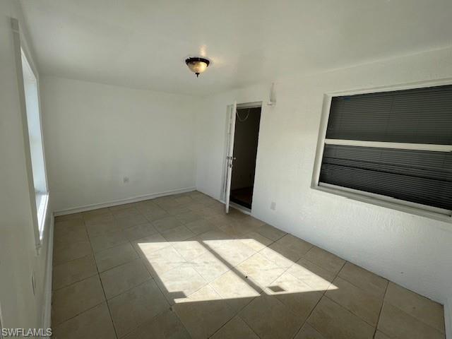 Spare room featuring light tile patterned flooring