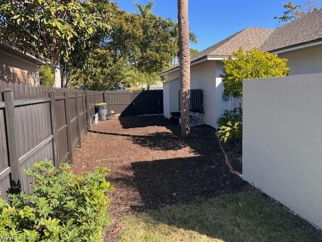 View of fenced backyard