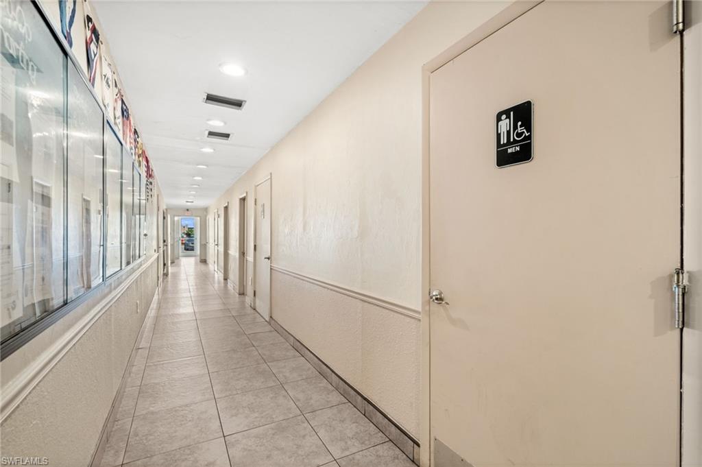 Rear entrance, hallway, and restrooms