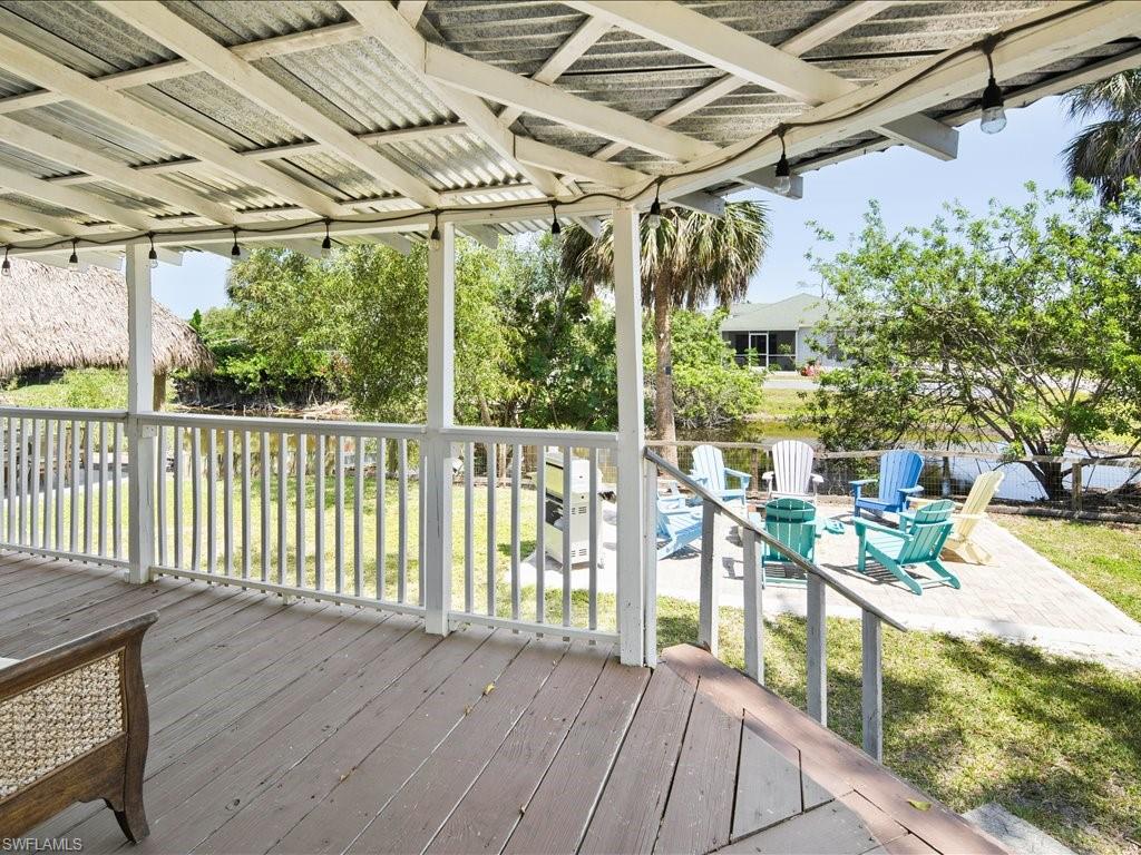 Wooden deck with a yard and a patio