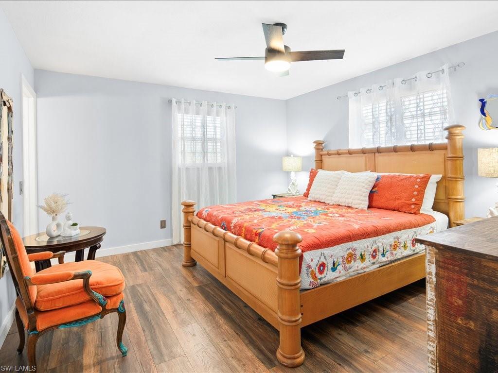 Bedroom featuring hardwood / wood-style floors and ceiling fan