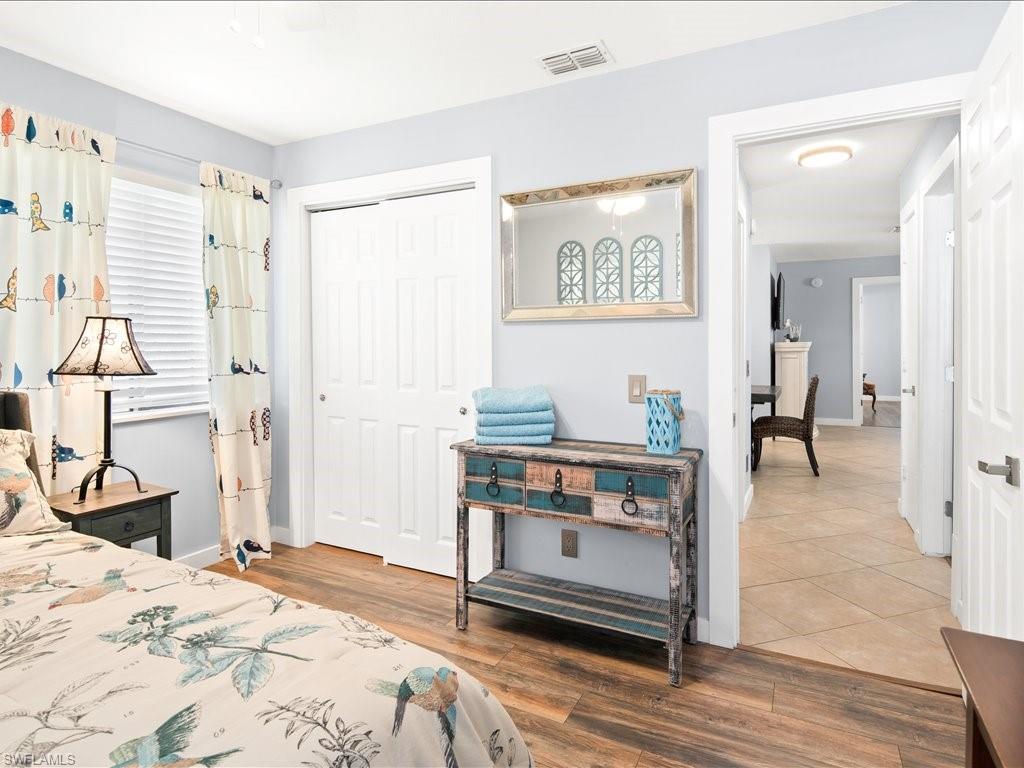 Bedroom with a closet and light wood finished floors