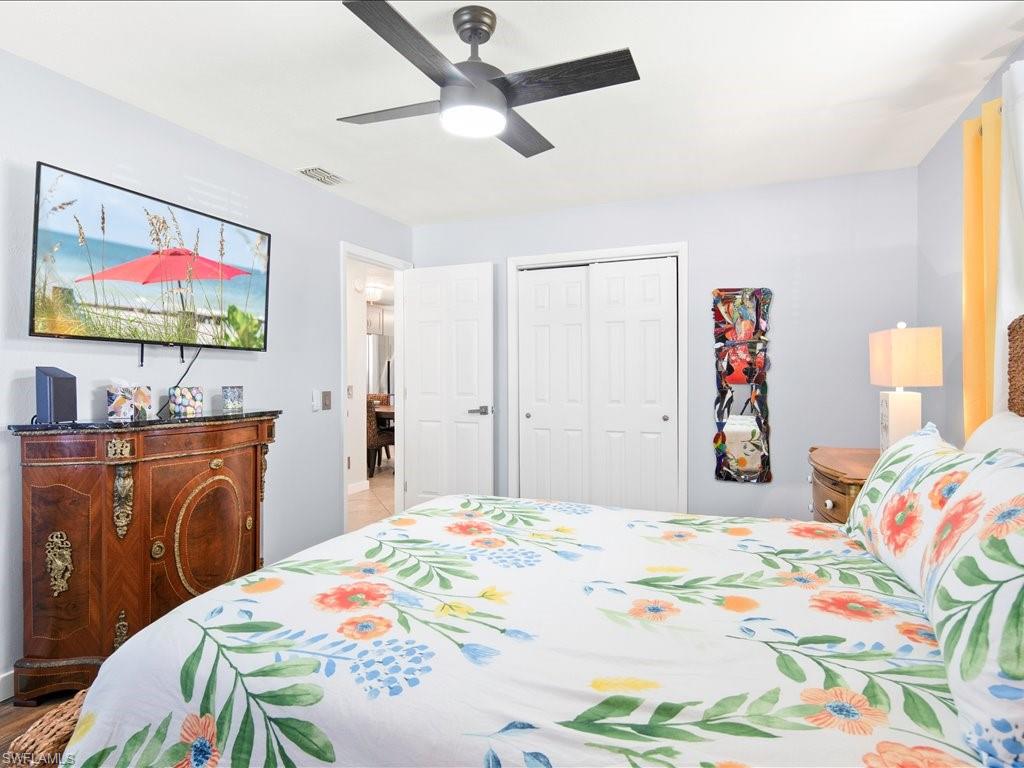 Bedroom featuring ceiling fan and a closet