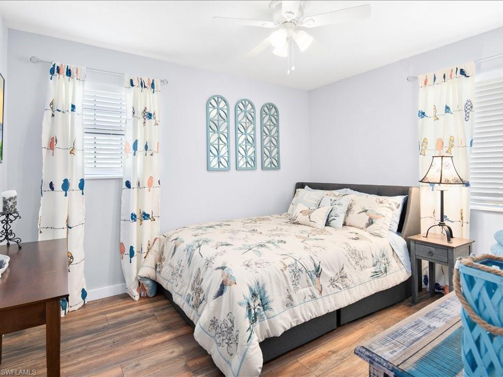 Bedroom featuring wood finished floors and a ceiling fan