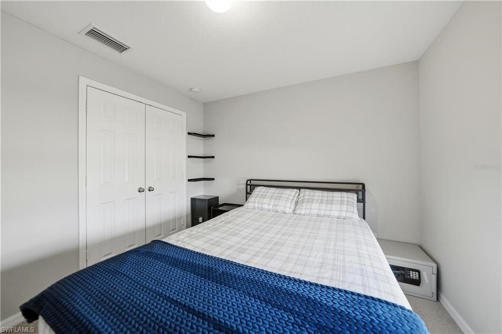 Bedroom with carpet floors and a closet