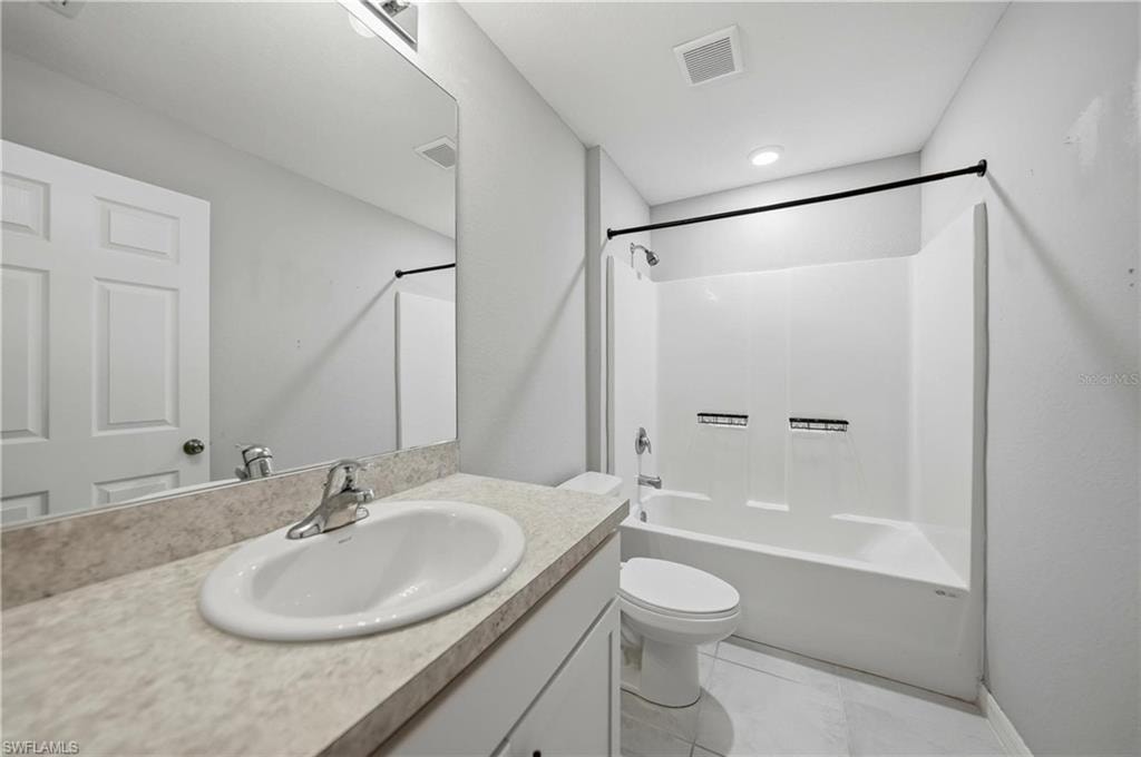 Full bathroom featuring shower / bath combination and vanity