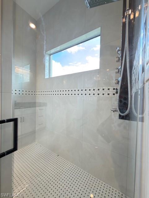 Bathroom with a stall shower and vanity