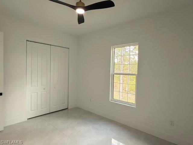 Bathroom with toilet and baseboards
