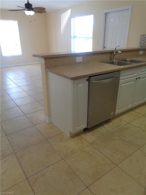 Kitchen featuring stainless steel dishwasher