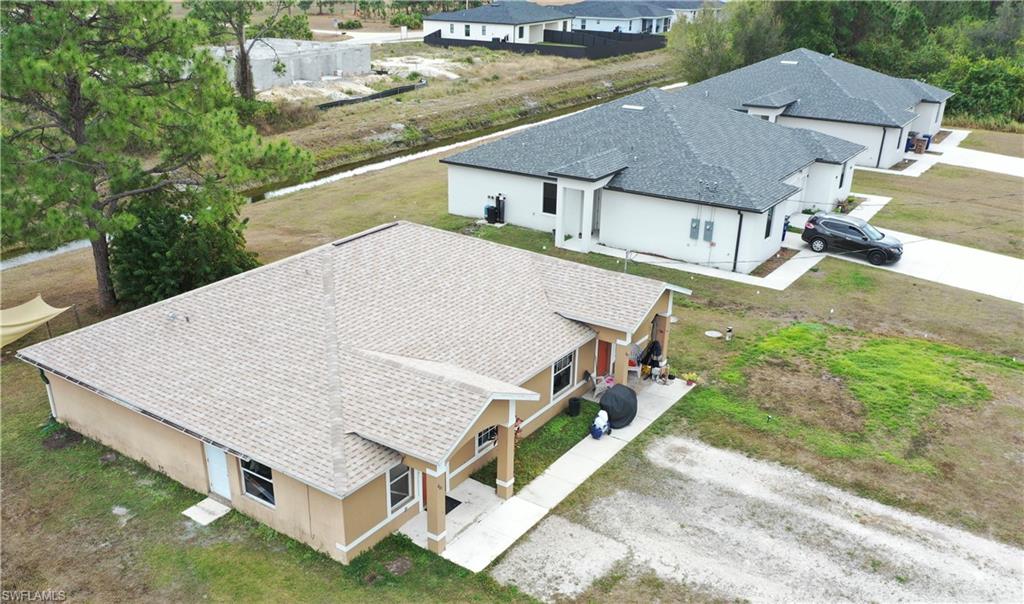 Aerial view of the property and surrounding area