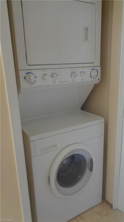 Laundry area featuring stacked washer and dryer