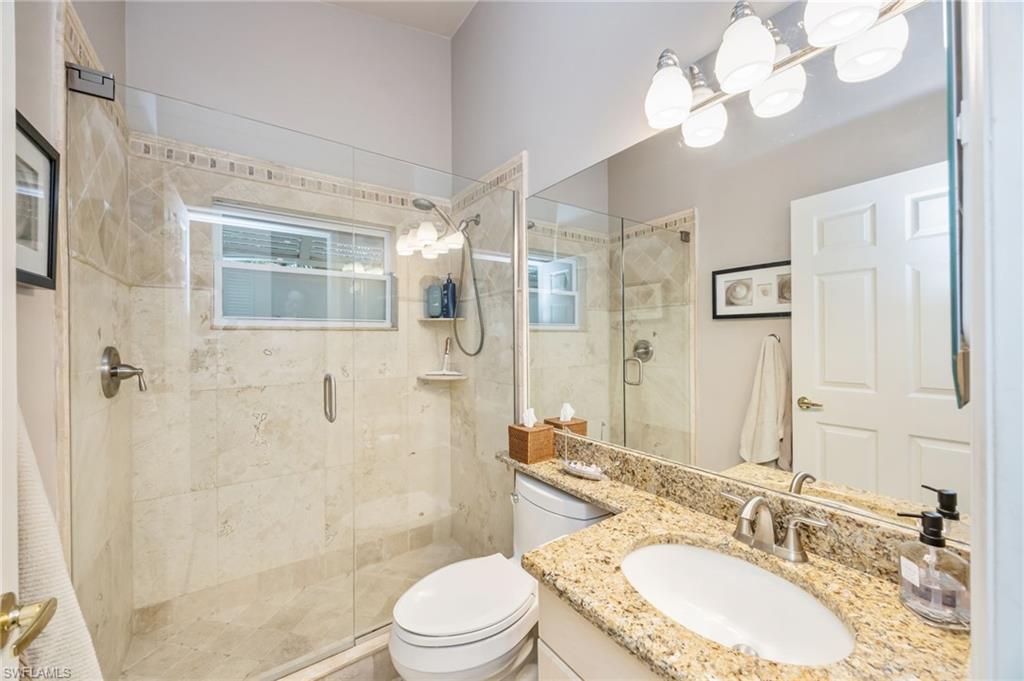Full bath with vanity and a stall shower