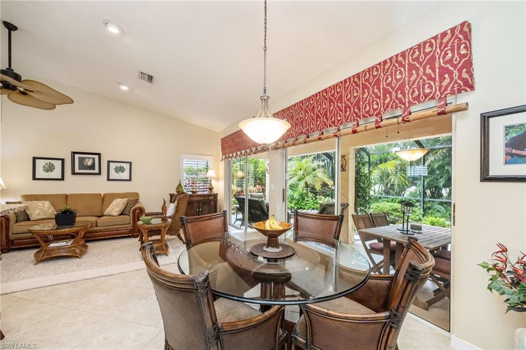 Dining room featuring light tile patterned floors, recessed lighting, high vaulted ceiling, and a ceiling fan