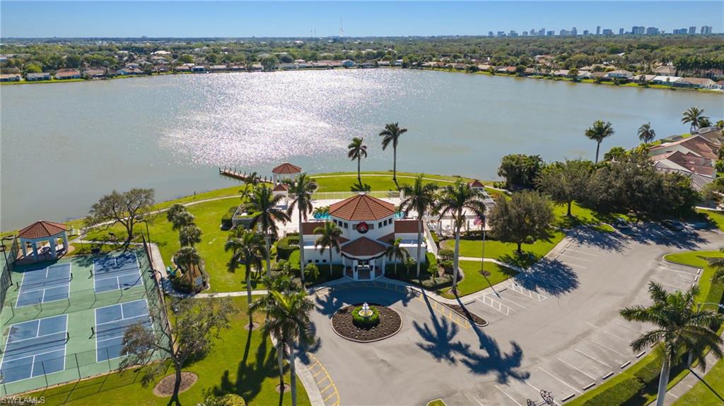 Aerial view of residential area featuring a large body of water