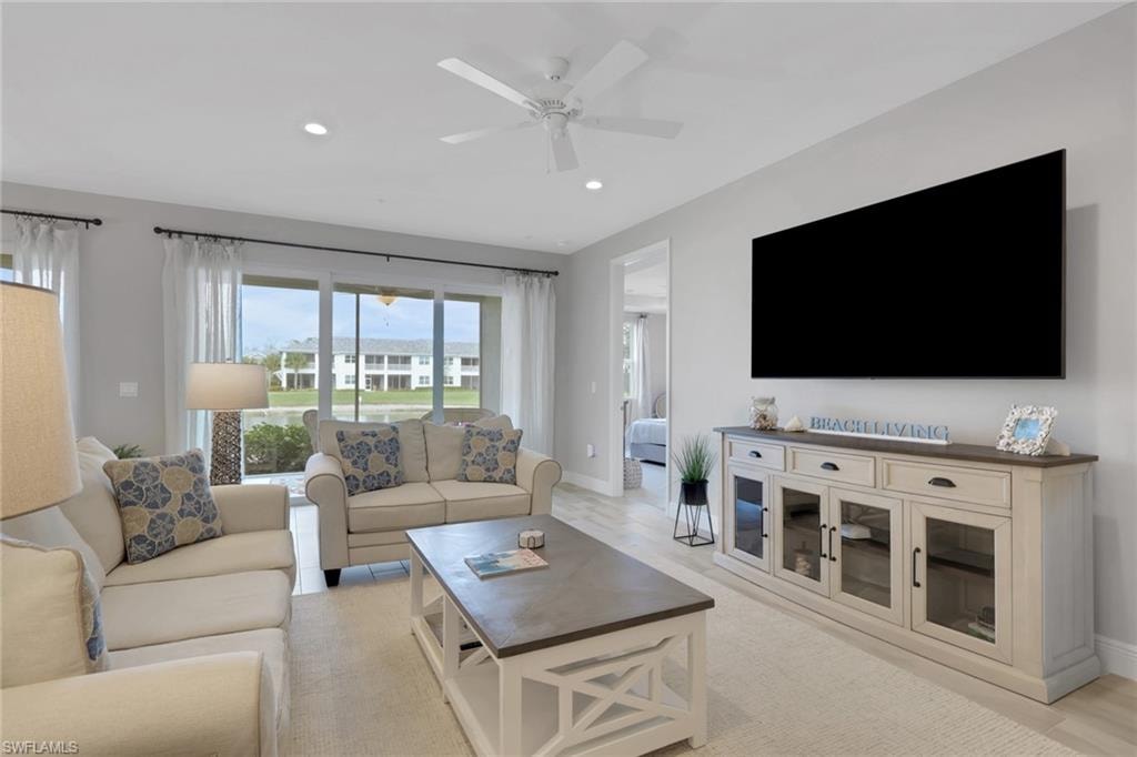 Living area with ceiling fan and recessed lighting